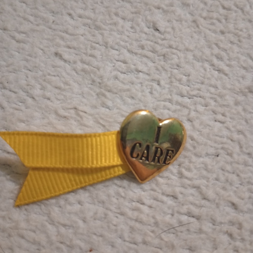 1991 Vintage Bob Siemon Designs "I Care" Pray Gold Tone Yellow Ribbon Heart Pin